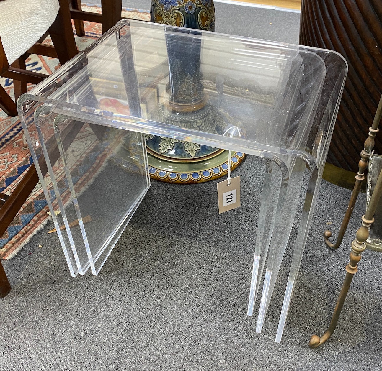 A nest of three contemporary curved perspex tea tables, width 44cm, depth 30cm, height 43cm